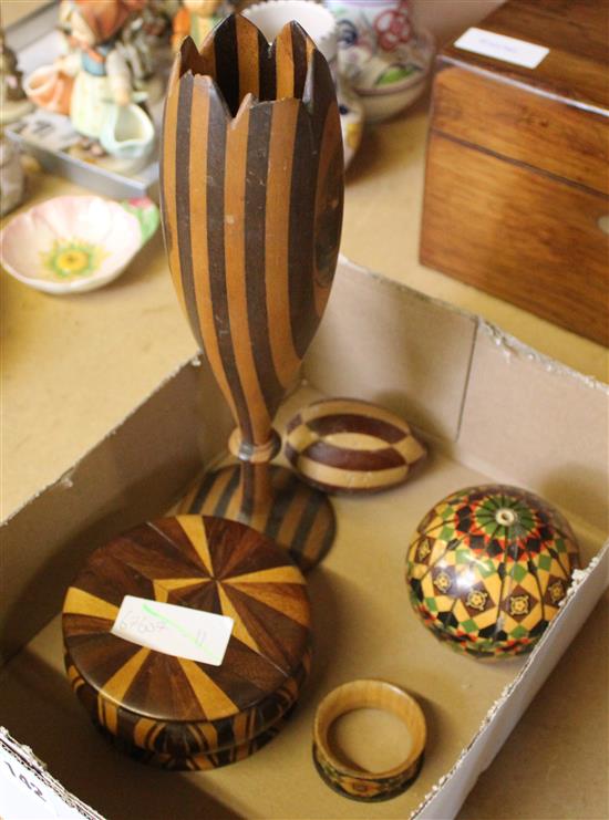 Mauchline ware- a vase, egg, a ball and a napkin ring and a turned specimen wood box